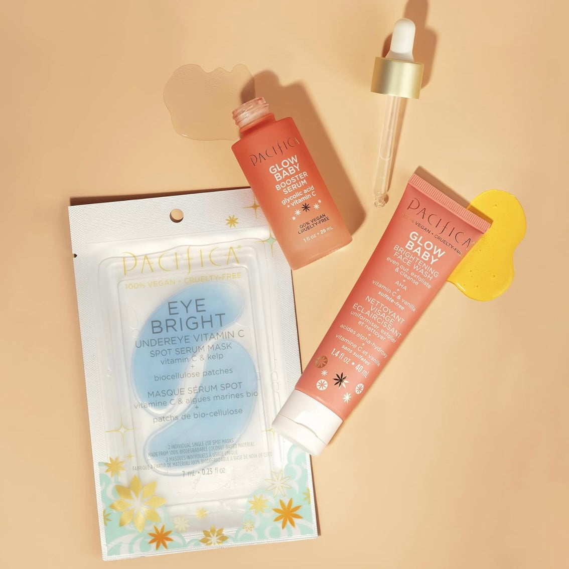 Pacifica beauty glow baby brighting wash, Glow boosting facial serum and kelp infused eye bright undereye mask kit on a peach background set as a flat lay style photo design