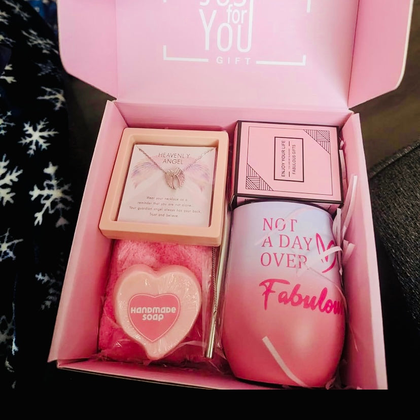 Dive into a world of luxury with our Fabulous Indulgence Gift Set. Specially curated for Valentine’s Day, this set includes a plush ‘Bring Me Some Chocolate’ sock, a heart-shaped handcrafted soap, an elegant tumbler inscribed with ‘Not A Day Over Fabulous’, a cupcake-shaped bath bubble bomb with sprinkles on top and last but definitely not least, to the best part of this luxury gift set which pays for the entire box two times over, You are also getting a 100% 925. Sterling Silver Diamond Cut Angel