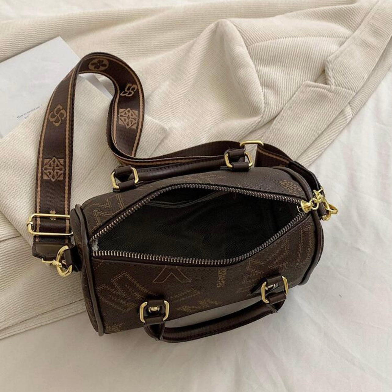 Designer leather vintage cross body adjustable coffee brown handbag with zipper gold accents and letter pattern style considered a “Boston bag” comes with a long adjustable removable matching straps and handles for adjustable convenience. This bag is only available at LadiesNGentz.com and also At Facetreasures Boutique at facetreasures.com debut for the first time on LadiesNgentz on Black Friday November 2023