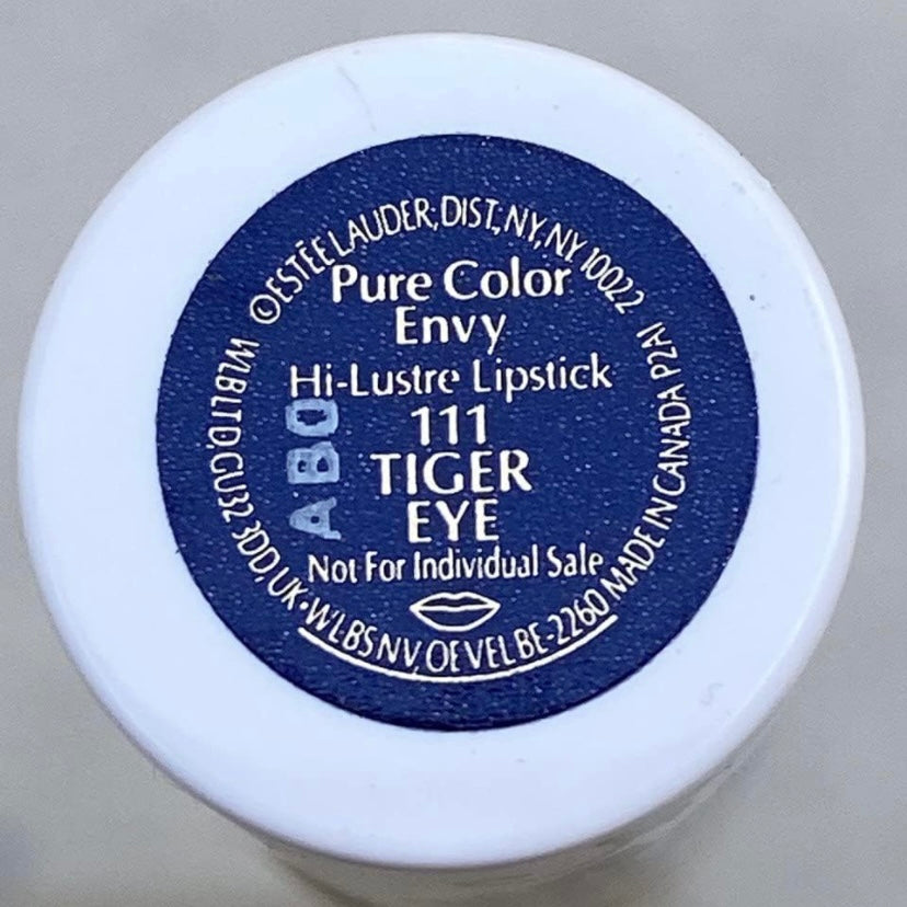 Estée Lauder Pure color Envy Limited Edition Lip sculpting lipstick in the color #111 Tiger Eye, lipstick is shown in a light blue and white design showing the label and color
