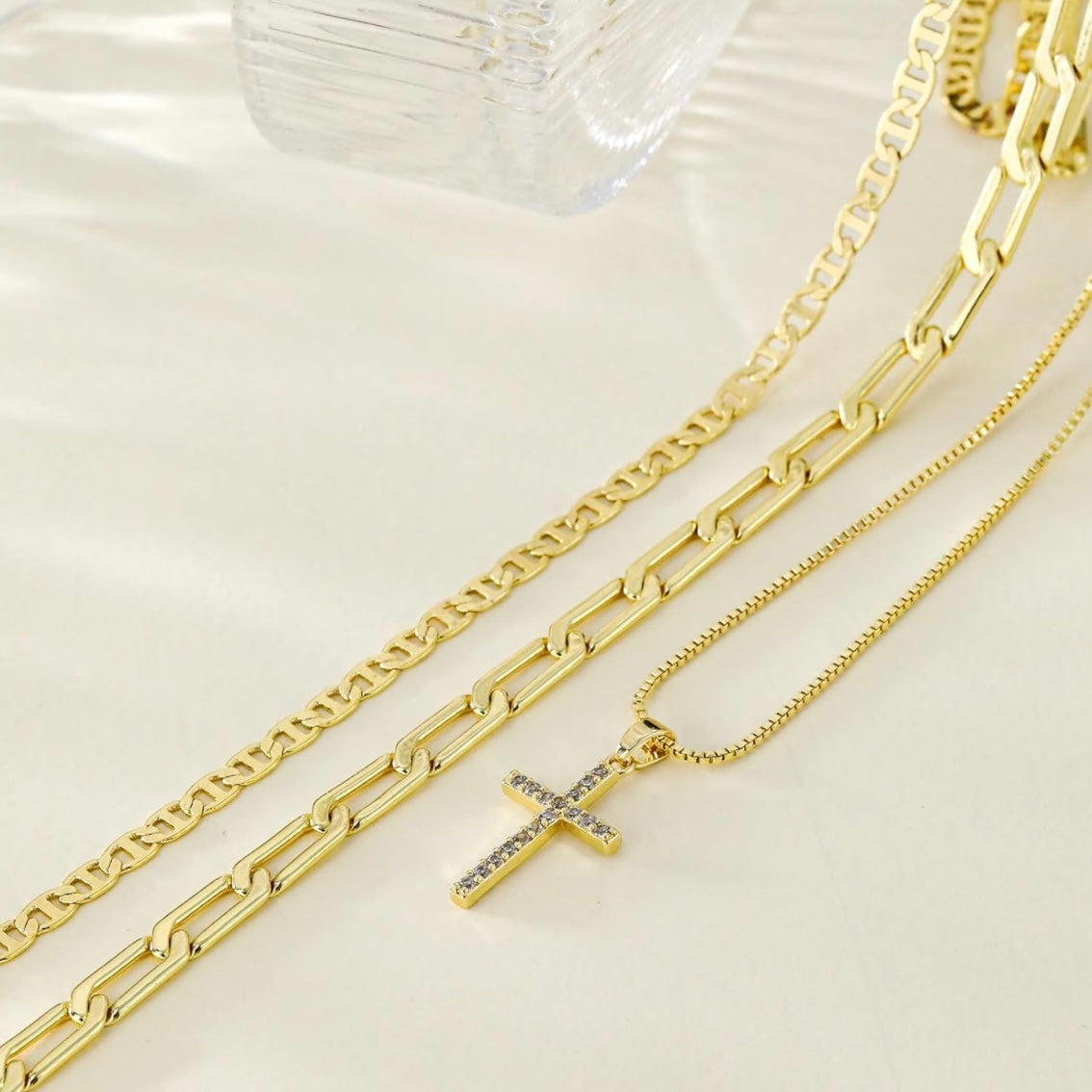 3 piece 14k gold plated layered necklace set with one necklace with a cross, wear alone or as a set.
