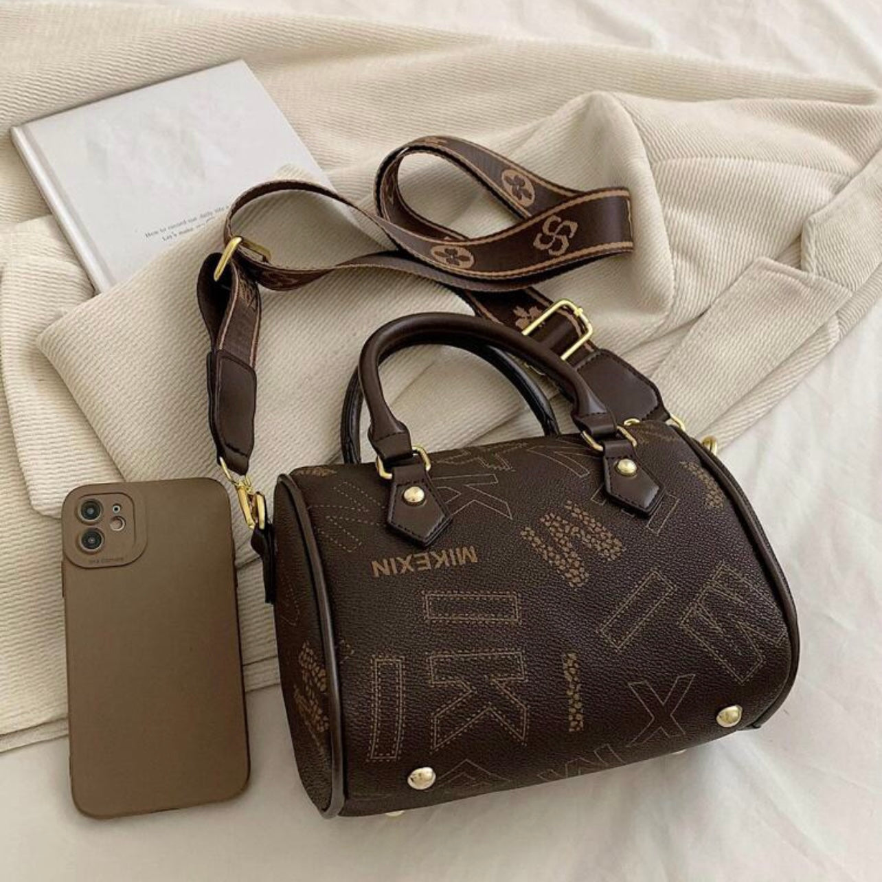 Designer leather vintage cross body adjustable coffee brown handbag with zipper gold accents and letter pattern style considered a “Boston bag” comes with a long adjustable removable matching straps and handles for adjustable convenience. This bag is only available at LadiesNGentz.com and also At Facetreasures Boutique at facetreasures.com debut for the first time on LadiesNgentz on Black Friday November 2023