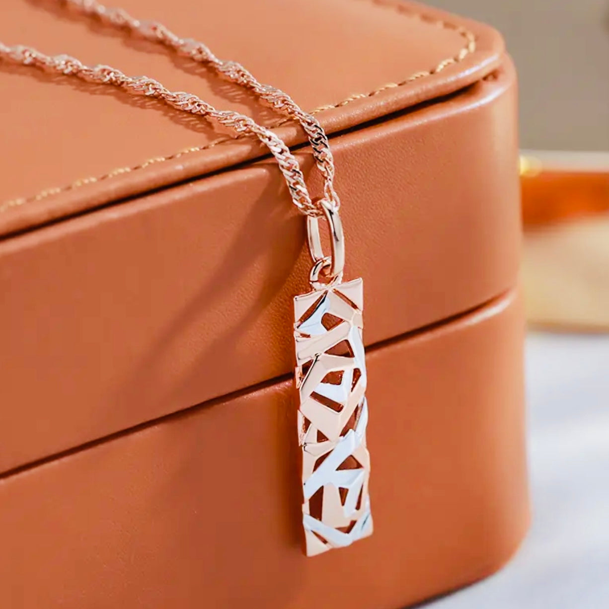 This Sterling Silver, Rose Gold, and High-grade Steel tricolor necklace and earrings set is perfect for any special woman in your life. Crafted with expertly sourced top-grade steel and silver material, these pieces are timeless and sure to make a lasting impression. The pendant is a twisted-rectangle shape adorned with dazzling sparkles, while the 18-inch link-style necklace complements with a bold yet elegant look. Matching tricolor earrings complete the set - perfect for any occasion!
