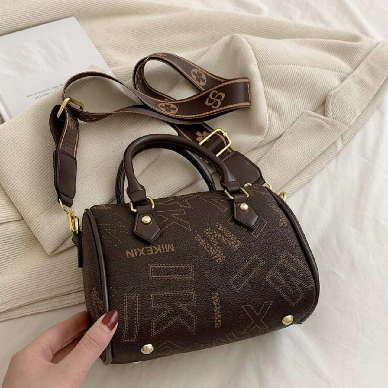 Designer leather vintage cross body adjustable coffee brown handbag with zipper gold accents and letter pattern style considered a “Boston bag” comes with a long adjustable removable matching straps and handles for adjustable convenience. This bag is only available at LadiesNGentz.com and also At Facetreasures Boutique at facetreasures.com debut for the first time on LadiesNgentz on Black Friday November 2023