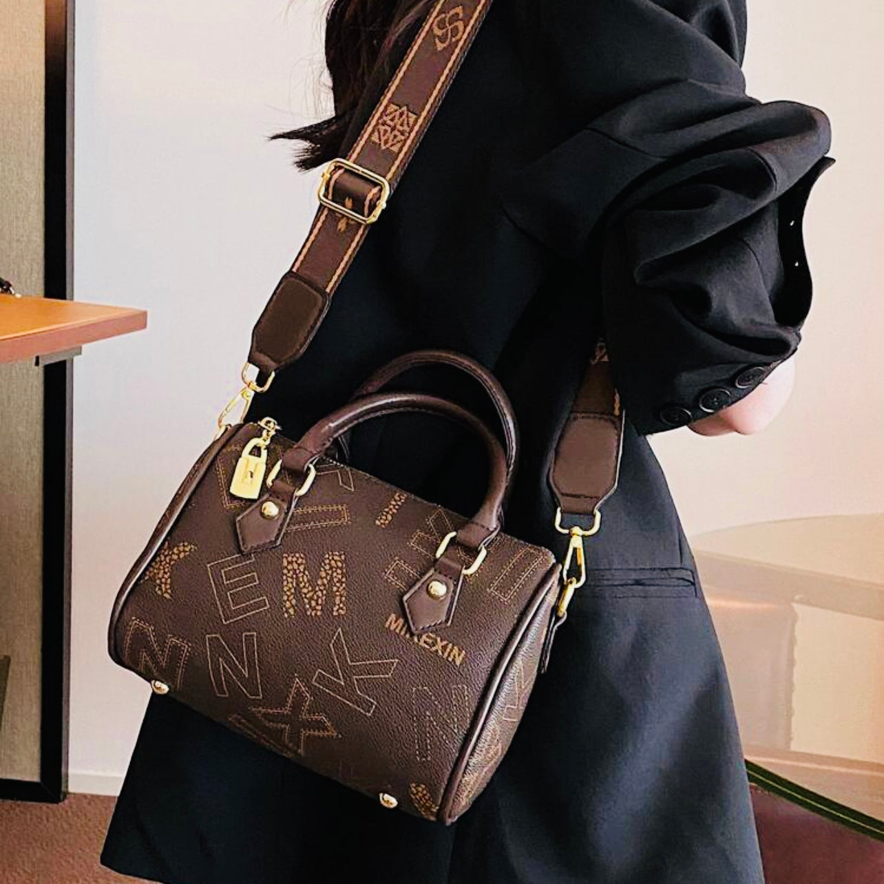 Designer leather vintage cross body adjustable coffee brown handbag with zipper gold accents and letter pattern style considered a “Boston bag” comes with a long adjustable removable matching straps and handles for adjustable convenience. This bag is only available at LadiesNGentz.com and also At Facetreasures Boutique at facetreasures.com debut for the first time on LadiesNgentz on Black Friday November 2023