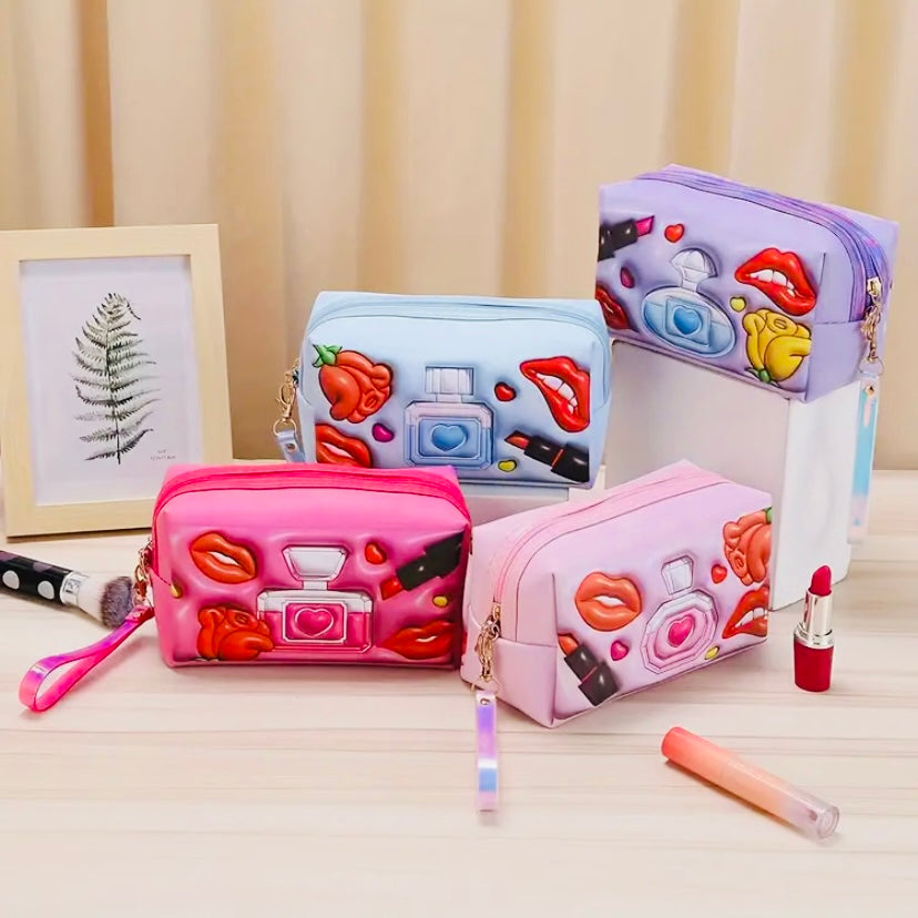 4 different color 3D glam makeup bags in Hot Pink, Baby Blue, Pastel Pink, and Purple with the option to purchase as a single bag or as an option to purchase a makeup bag that includes 6 premium mystery beauty items for an additional cost.