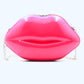 Hot pink lip handbag with gold accent shoulder chain on display 