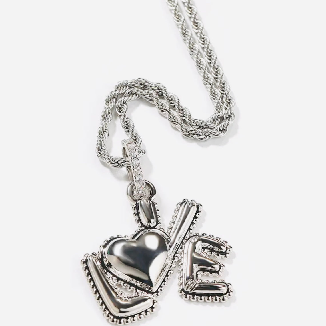 love pendant in the color pink, blue, silver or silver chrome with a matching diamond chain or silver or gold rope chain available only at Facetreasures.com