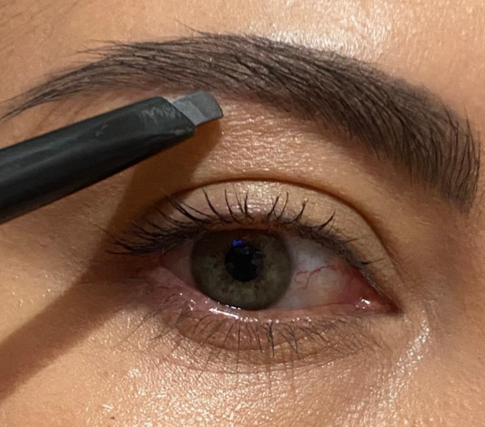 Anastasia brow definer brow pencil with spoolie in the color tuape with triangle tip and build able wax color giving an all natural brow appearance