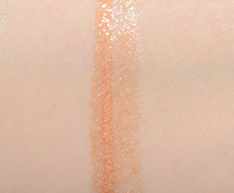 This Lip Gloss Is A very warm-toned, light-medium Tan (Soft Brown) with a hint of Peach pearl finish. It is a sheer lip-gloss that not sticky and goes on smooth and with ease. The 3D light-reflecting pigments as well as Ginger, Peppermint oil, and a non-stinging peptide make lips appear fuller and smoother. Contains Vitamins C and Vitamin E, plus hydrating Shea Butter and Muru Muru Butters to soften, protect and condition the lips. Becca Champagne Cocktail Lip Gloss shade "Bellini"