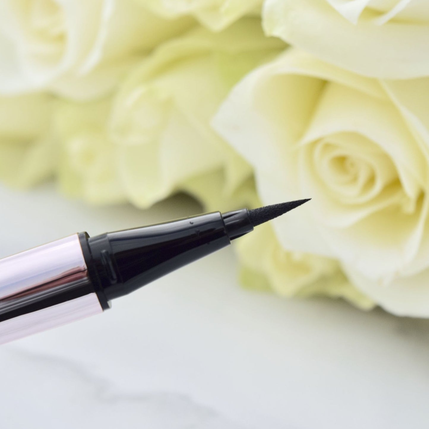 Fenty fly liner liquid eyeliner in the color "cuz I'm black" satin black color, A hyper-saturated, water-resistant liquid eyeliner with an innovative flex tip and easy-grip triangle shape for effortless no-limit lining that lasts.