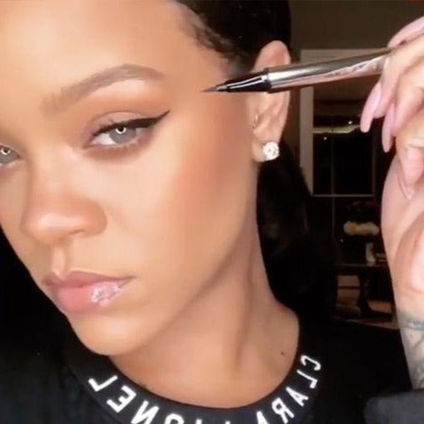 Fenty fly liner liquid eyeliner in the color "cuz I'm black" satin black color, A hyper-saturated, water-resistant liquid eyeliner with an innovative flex tip and easy-grip triangle shape for effortless no-limit lining that lasts.