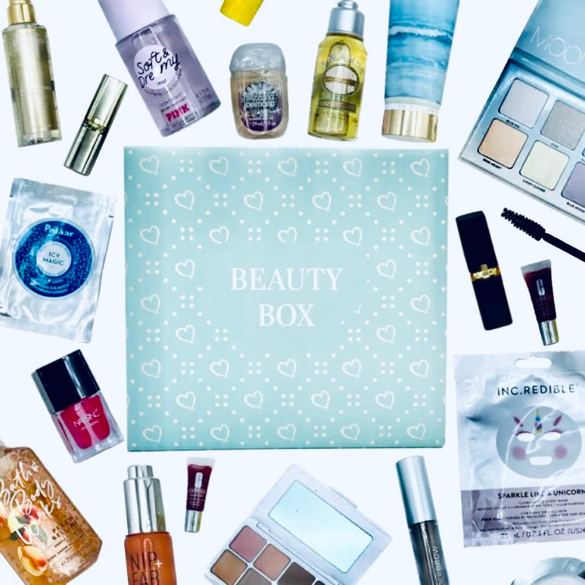 Luxury Beauty Surprise Box - Facetreasures Premium Skincare & Jewelry Mystery Gift with this photo showing several of the premium beauty and skincare items we have that may be included in the customers box such as Victoria Secret, YSL lipstick, Lush Bath bombs, Nexus Haircare, Jewelry, Eyeshadow Palettes and anti aging skincare
