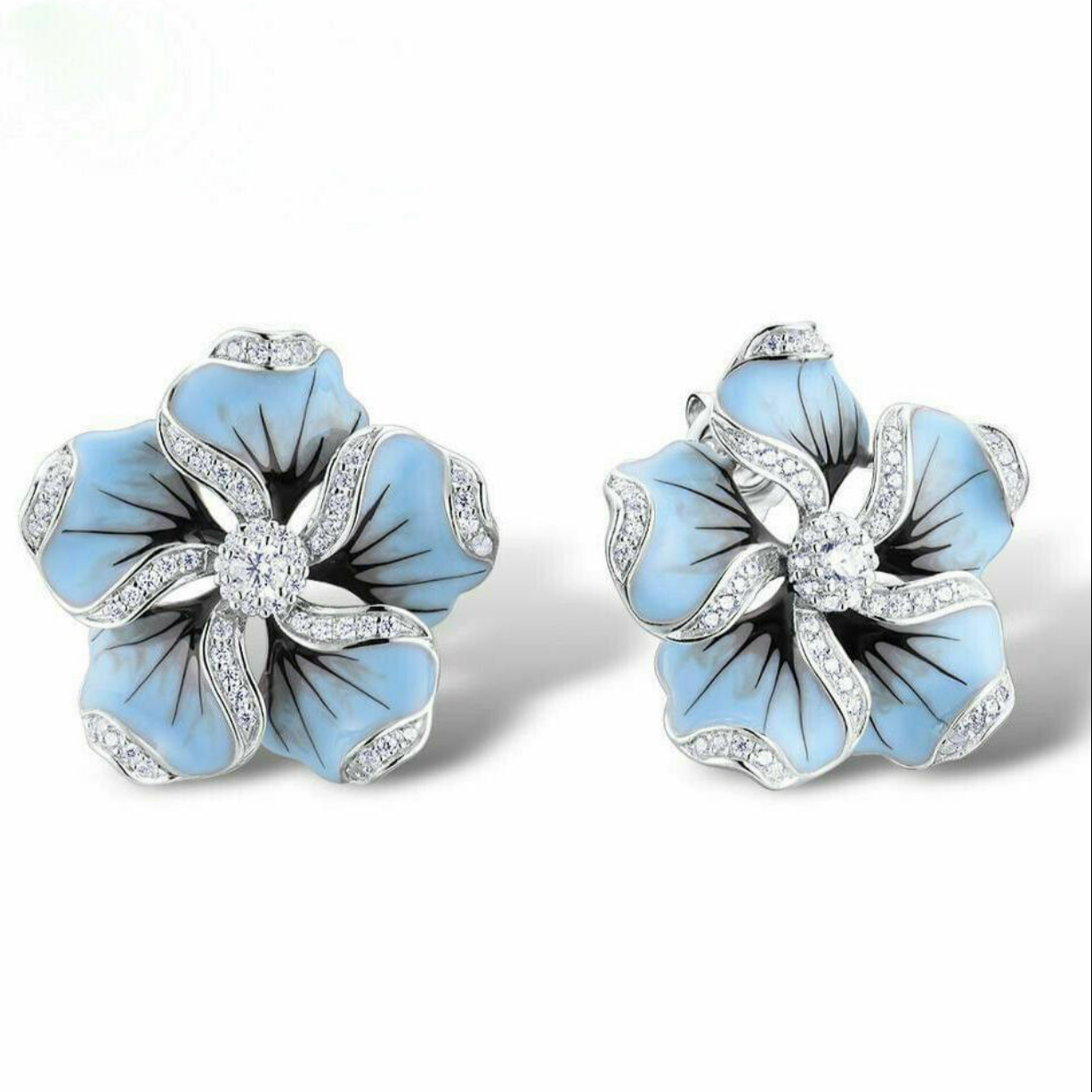 Preciosos pendientes de flores con incrustaciones de zafiro azul pastel de plata 925