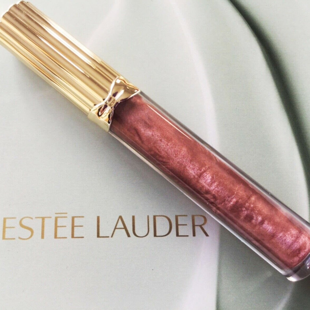 Gloss to make em envy, All natural lip plumping gloss that gives result immediately & With a Estee Lauder pure color envy #115 flashfire -Shine so bright, you can't help but kiss it.