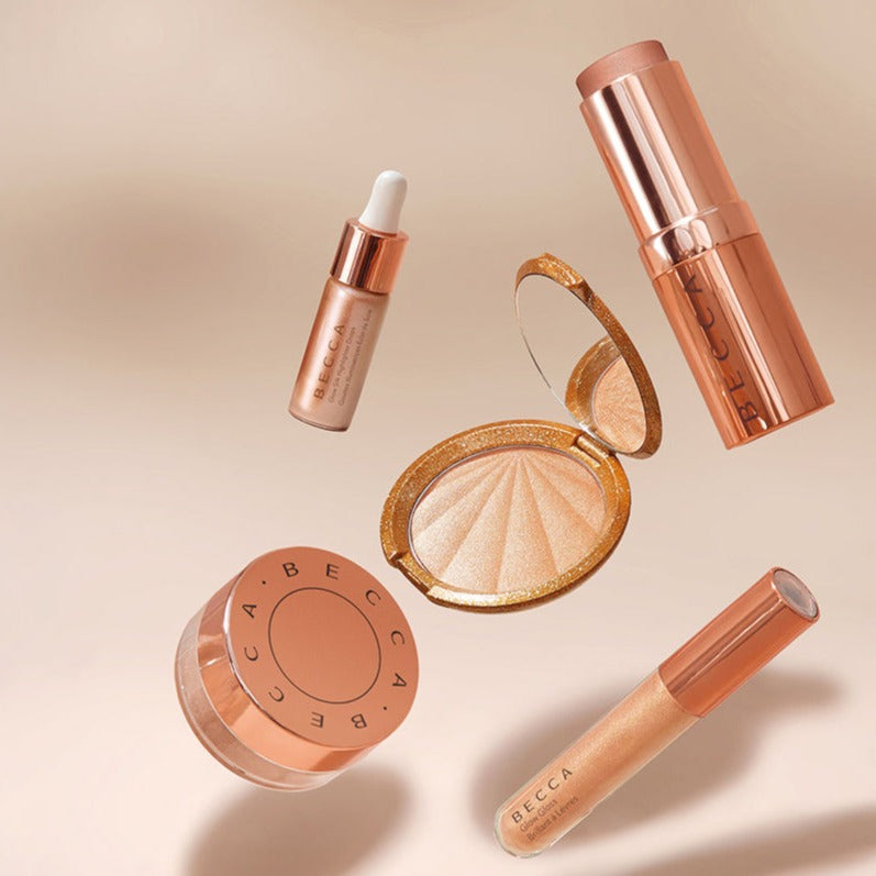 This Lip Gloss Is A very warm-toned, light-medium Tan (Soft Brown) with a hint of Peach pearl finish. It is a sheer lip-gloss that not sticky and goes on smooth and with ease. The 3D light-reflecting pigments as well as Ginger, Peppermint oil, and a non-stinging peptide make lips appear fuller and smoother. Contains Vitamins C and Vitamin E, plus hydrating Shea Butter and Muru Muru Butters to soften, protect and condition the lips. Becca Champagne Cocktail Lip Gloss shade "Bellini"