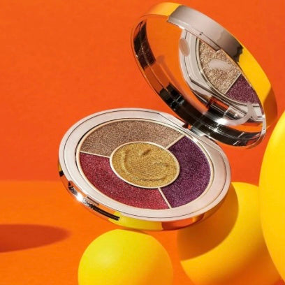 Ciate London smiley face eyeshadow compact with mirror showing the 4 beautiful spring colors of eyeshadow