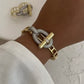 Elegant 10k Gold and Silver Buckle Bracelet & Matching Adjustable Double Finger Buckle Ring Set - Unique Intertwined Design