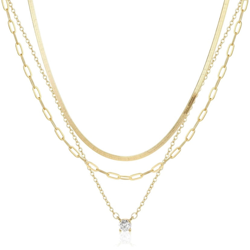 Layered Gold Necklaces: 3-Piece 14K Vermeil Gold over solid 925. Silver necklace set for Women, this set includes one 16 inch clavicle herringbone 14 karat vermeil gold necklace, one 17 inch paperclip style 14 karat Vermeil gold & one 18inch necklace with a 1 carat total weight of flawless princess cut cubic zirconia pendant. All 3 are beautiful worn as a layered style or can be worn separately. Only available for purchase at Facetreasures.com