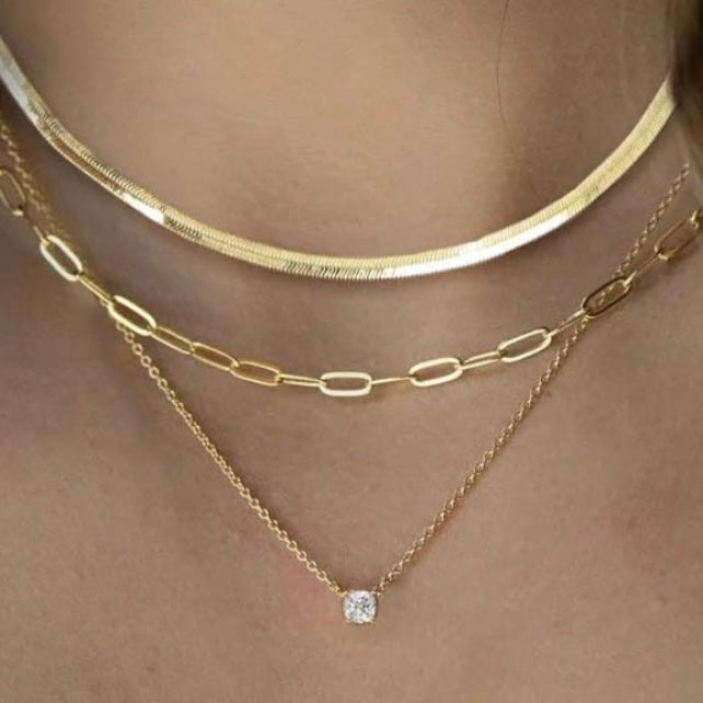 Layered Gold Necklaces: 3-Piece 14K Vermeil Gold over solid 925. Silver necklace set for Women, this set includes one 16 inch clavicle herringbone 14 karat vermeil gold necklace, one 17 inch paperclip style 14 karat Vermeil gold & one 18inch necklace with a 1 carat total weight of flawless princess cut cubic zirconia pendant. All 3 are beautiful worn as a layered style or can be worn separately. Only available for purchase at Facetreasures.com￼