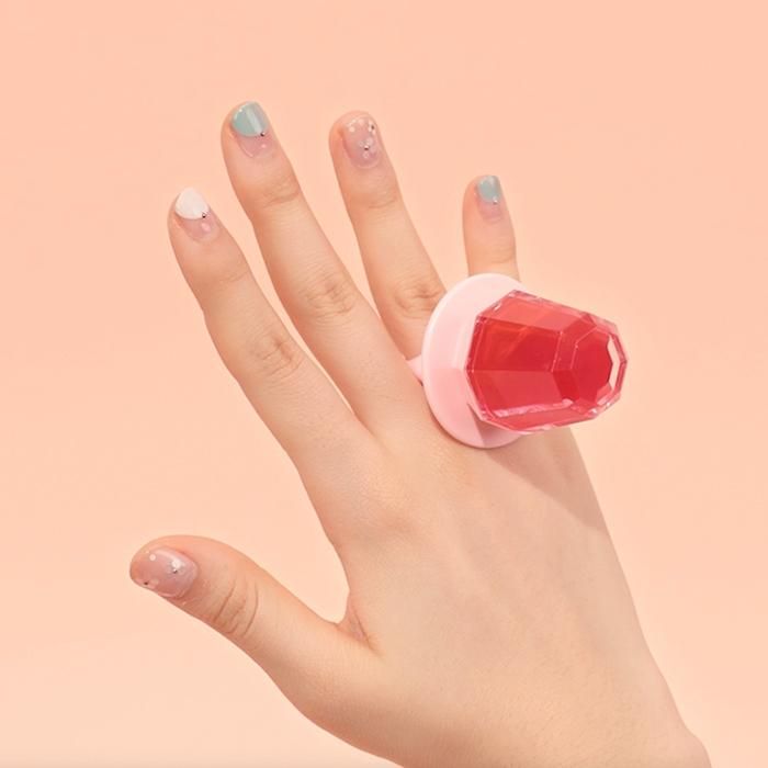 Avon Lip Tint In A Ring Shaped Lip Product That You Can Wear On Your Lips Or Hand For Show