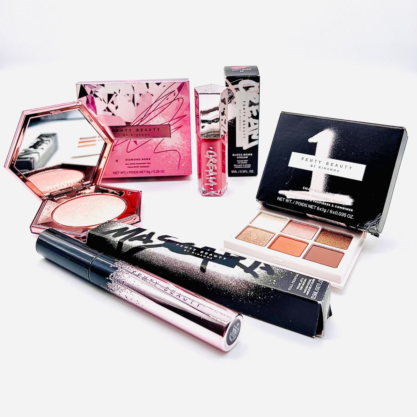 fenty beauty 4 piece designer beauty makeup set which includes mascara, lip gloss, eyeshadow and a highlighter