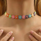 multi colored pastel floral themed handsowed hand crafted flower choker necklace with a stainless steel and silver 5 inch extender, excellent bridal gift, spring attire, can be worn with casual or elegant wear and great to wear for any type of event