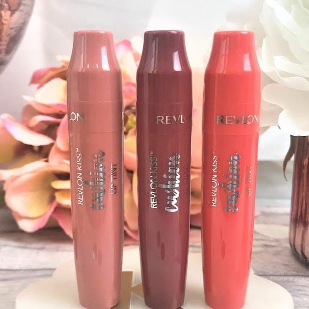 The look of a stain and comfort of a balm. -Infused with Coconut oil so lips feel moisturized and smooth. -Pillowy soft cushion tip gives a touch of color and builds for more impact. -Juicy tint with a balm-like finish, dries to a blotted lip look. photo is of 3 different lip tints by revlon shown in a more day time look and all natural light